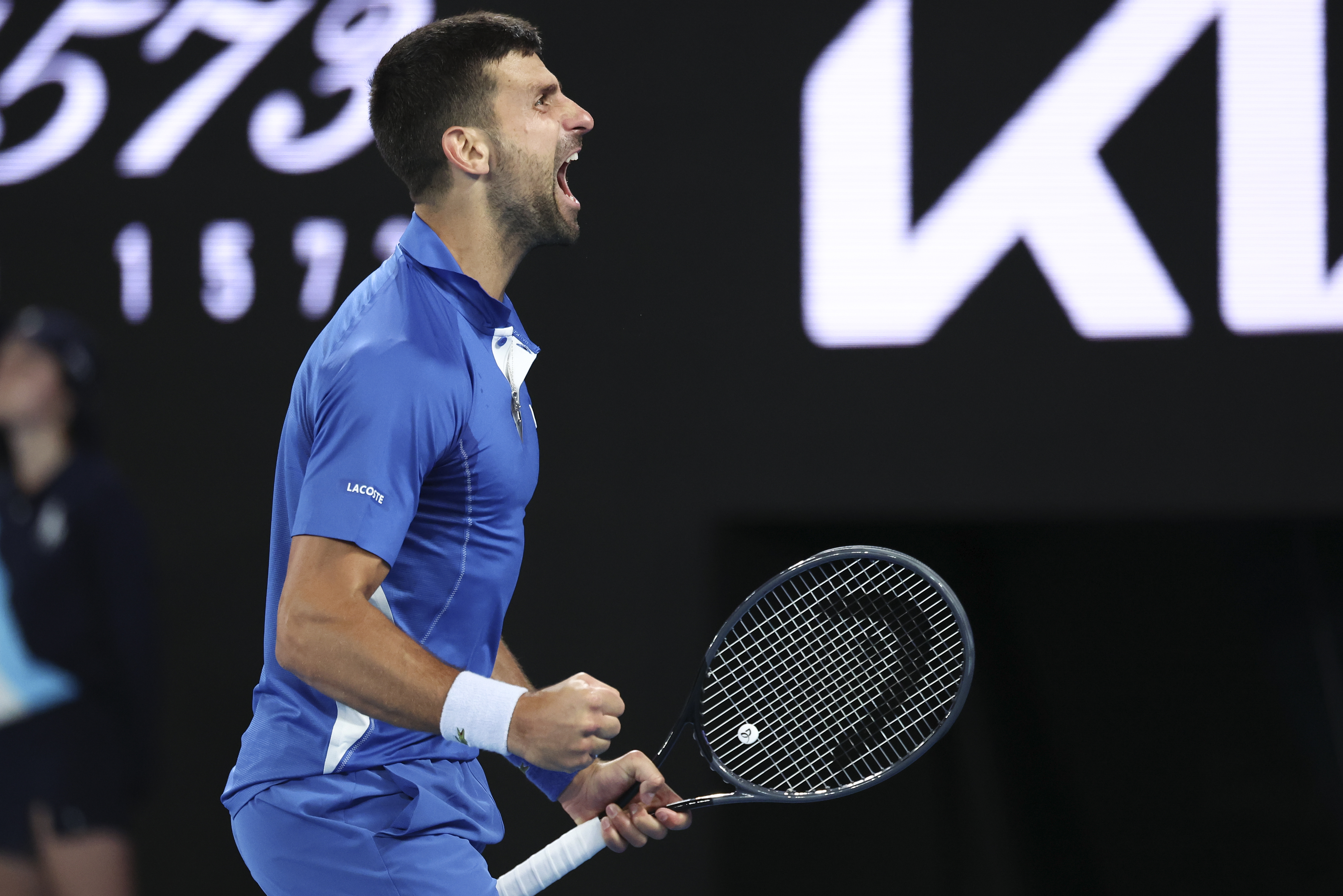 Novak Djokovic celebrates beating Alexei Popyrin