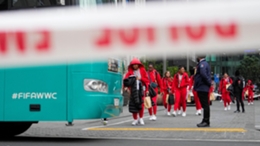 Members of the Philippines Women’s World Cup team walk to their team bus following a shooting near their hotel in the central business district in Auckland (Abbie Parr/AP)