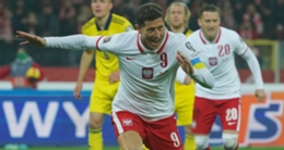 Robert Lewandowski celebrates Poland's opening goal against Sweden.