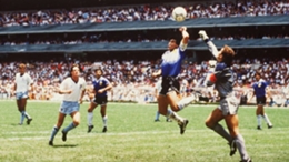 Diego Maradona scores his "Hand of God" goal against England