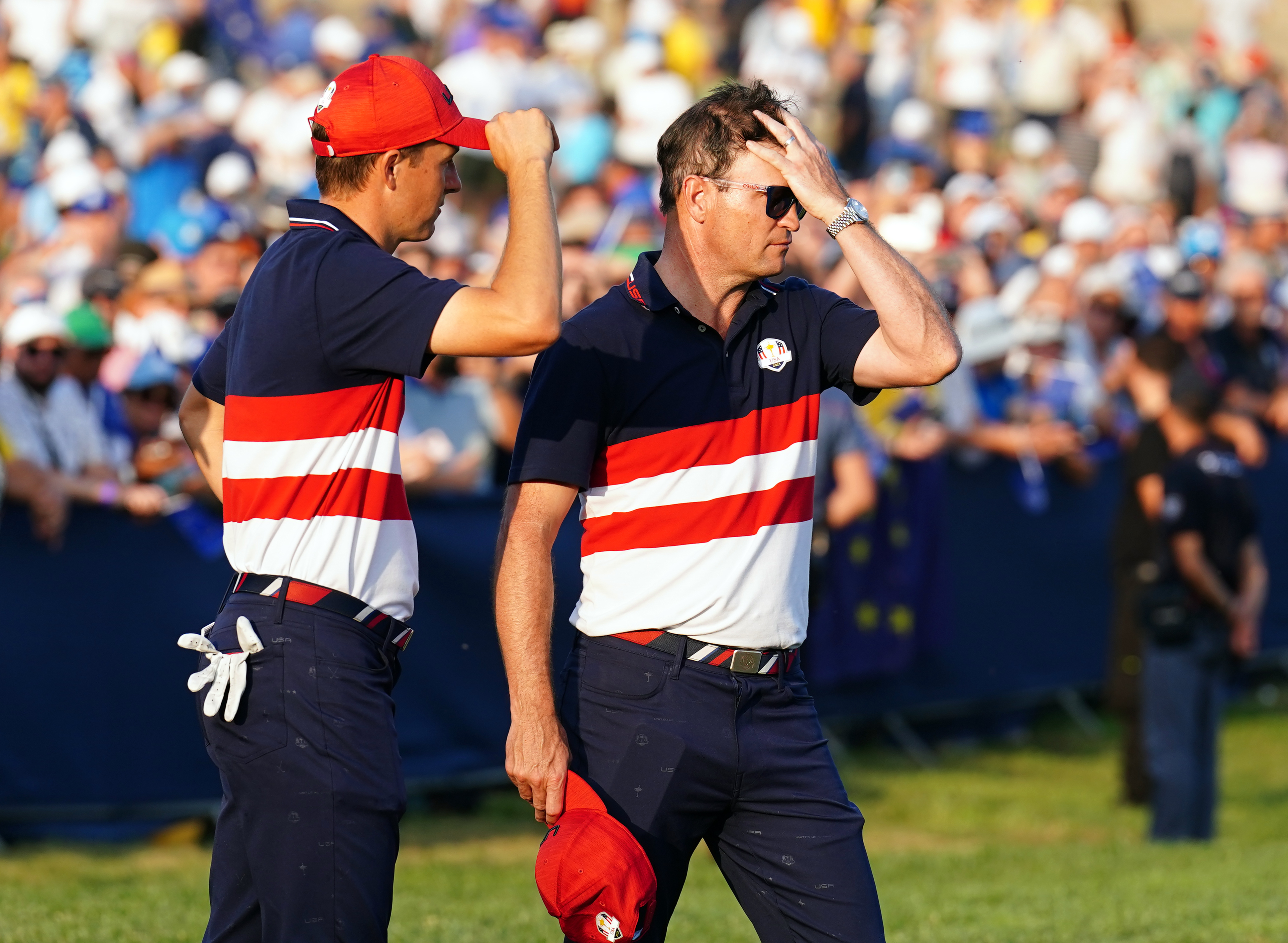 USA captain Zach Johnson, right, stands dejected alongside Jordan Spieth