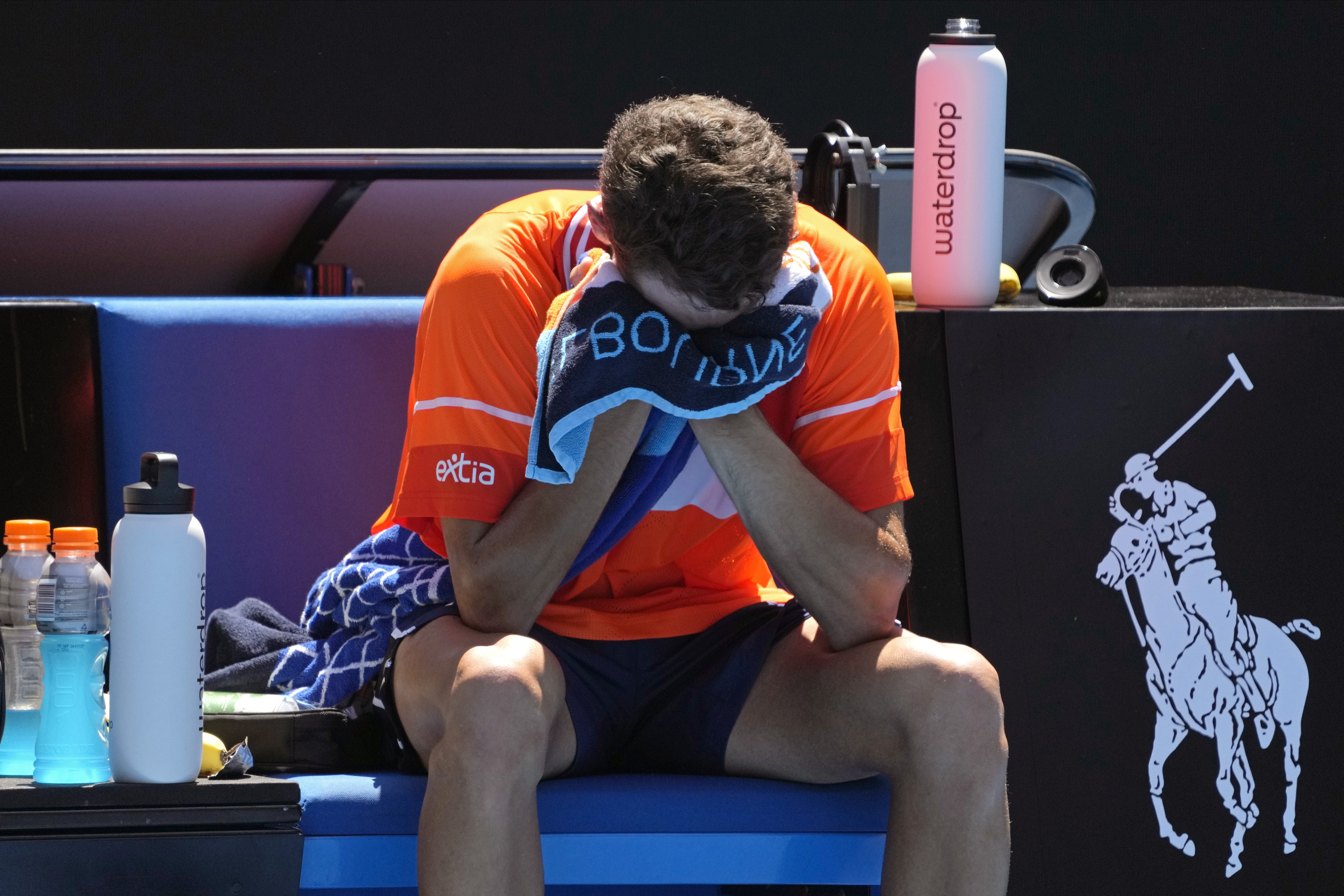 Terence Atmane sobs into his towel
