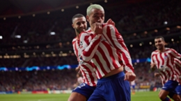 Antoine Griezmann kisses the badge after firing Atletico Madrid to victory on Wednesday