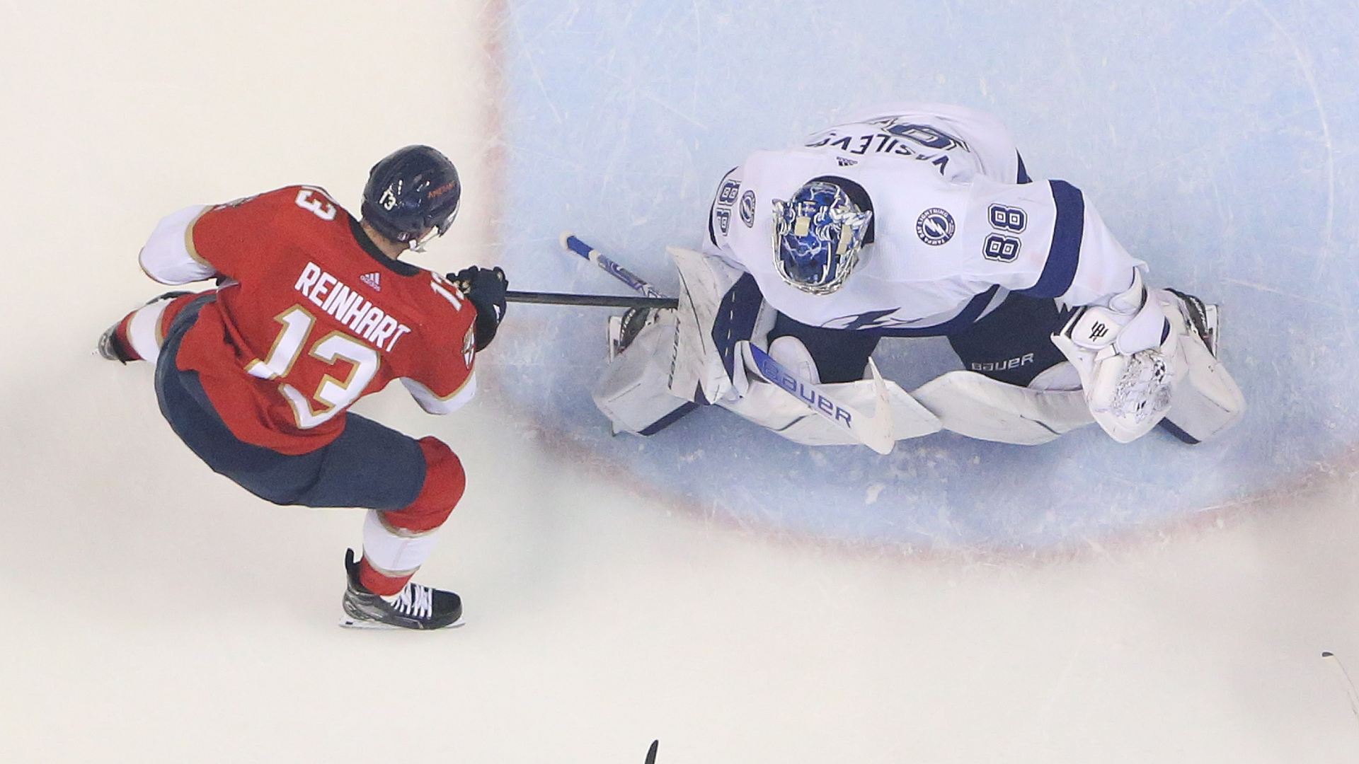 Goaltender Andrei Vasilevskiy of the Tampa Bay Lightning stops a third period shot by Sam Reinhart of the Florida Panthers in Game One