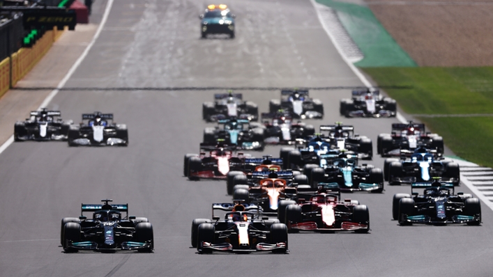 Lewis Hamilton and Max Verstappen at the front of the British Grand Prix before their collision