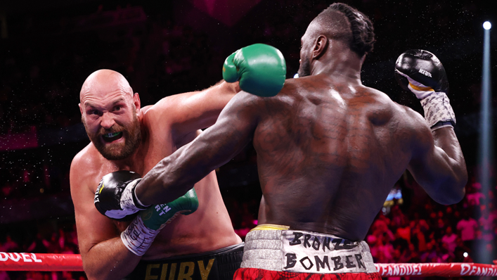 Tyson Fury punches Deontay Wilder during their WBC heavyweight championship at T-Mobile Arena
