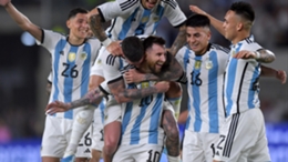 Argentina players swarm Lionel Messi to celebrate the 800th goal of his career