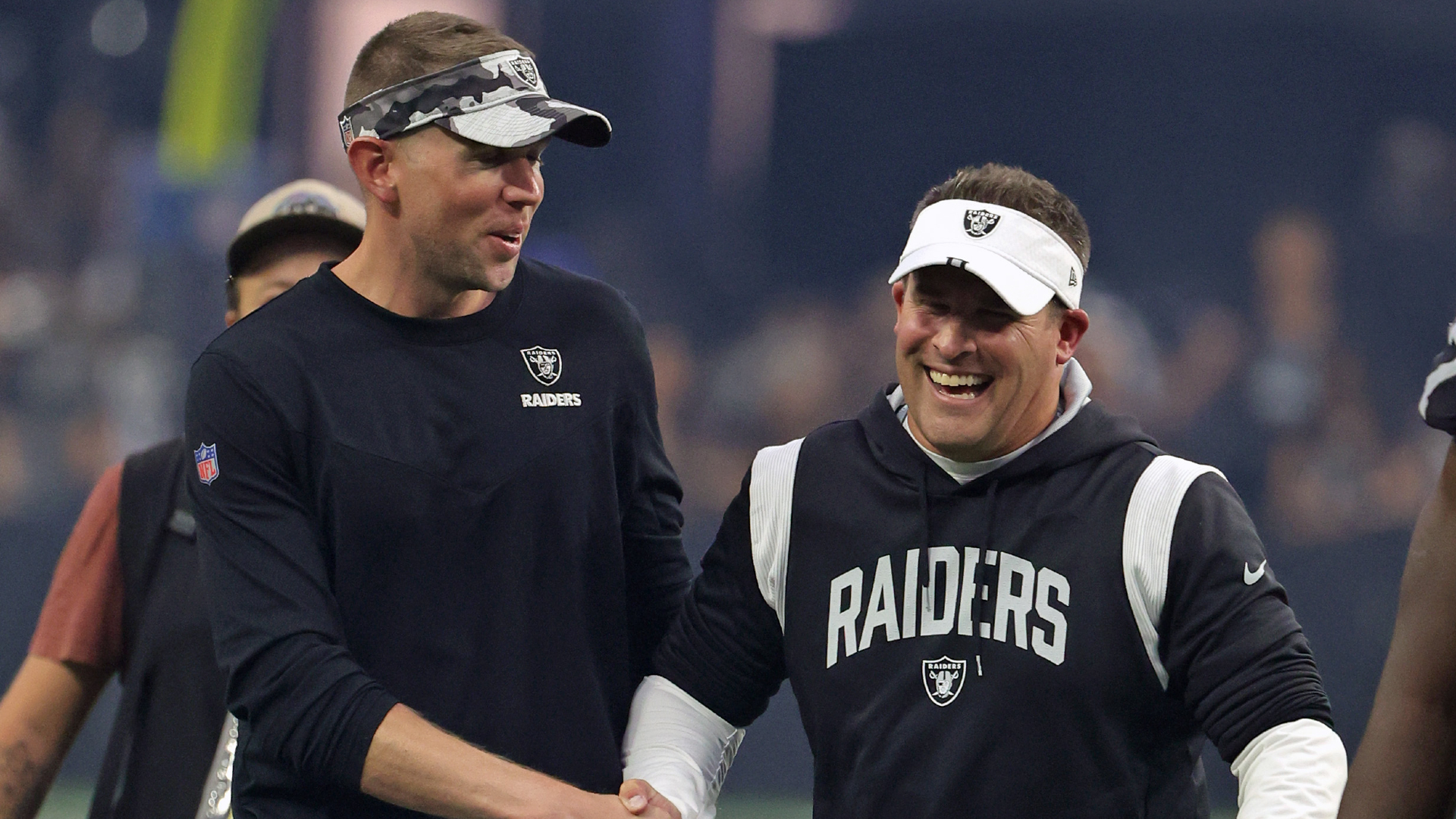 Raiders head coach Josh McDaniels (right) was all smiles with quarterback coach Bo Hardegree after his first game at Allegiant Stadium