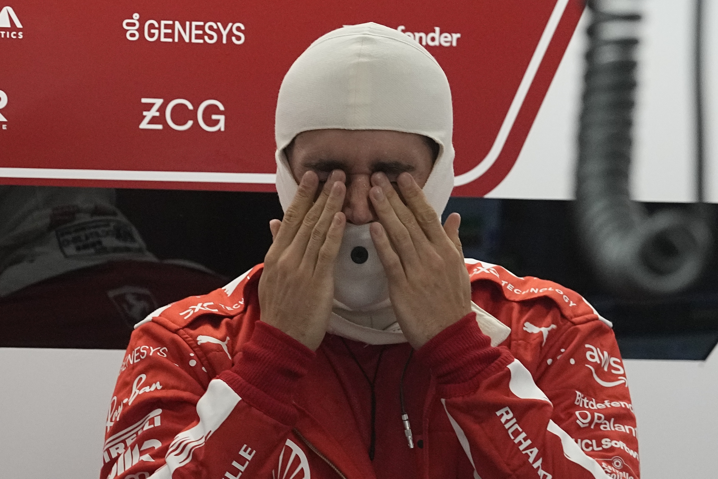 Ferrari driver Charles Leclerc rubs his eyes before the start of the second practice session