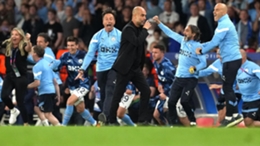 Manchester City manager Pep Guardiola and players celebrate winning the Champions League final (Martin Rickett/PA)