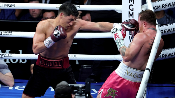 Dmitry Bivol (L) and Canelo Alvarez (R) clash