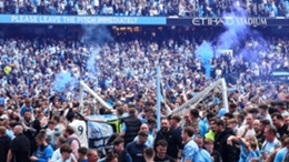Fans flooded the pitch after Manchester City's title win