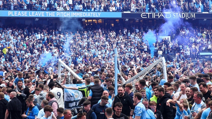 Fans flooded the pitch after Manchester City's title win