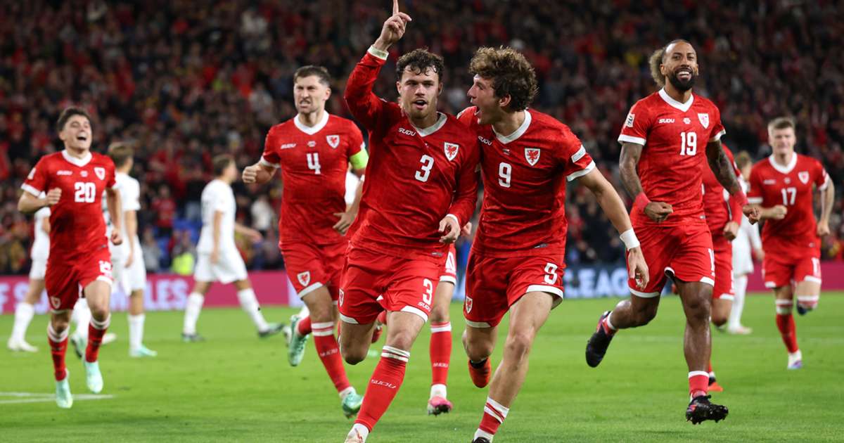 Neco Williams of Wales scores the decisive free-kick against Norway