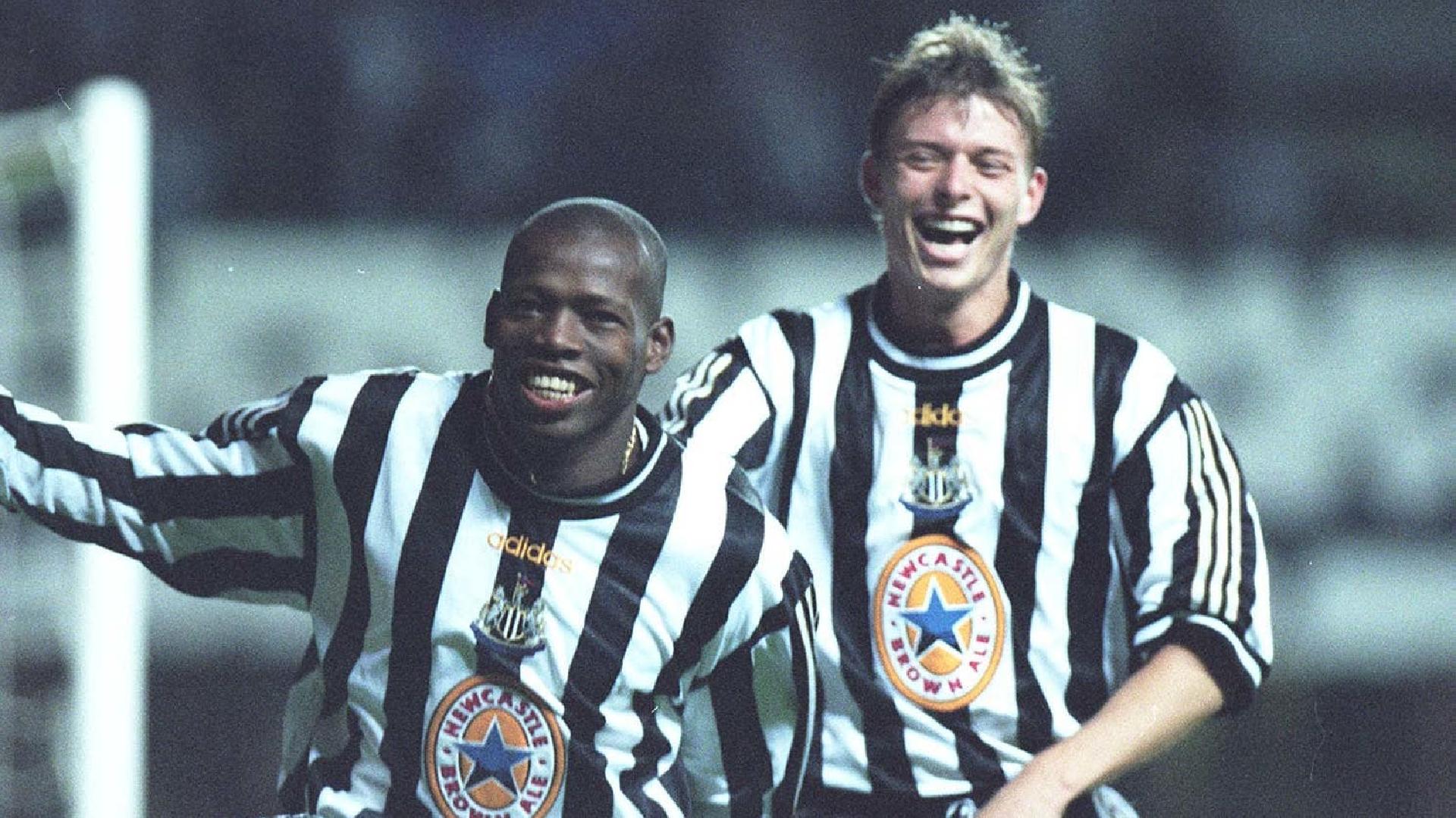 Jon Dahl Tomasson (right) congratulates hat-trick hero Faustino Asprilla during the 3-2 Champions League victory over Barcelona (Owen Humphreys/PA)