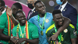 Senegal's forward Sadio Mane, Senegal's goalkeeper Edouard Mendy and Senegal's forward Bamba Dieng celebrate after winning the Africa Cup of Nations