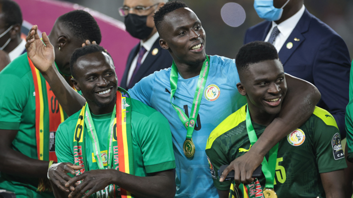 Senegal's forward Sadio Mane, Senegal's goalkeeper Edouard Mendy and Senegal's forward Bamba Dieng celebrate after winning the Africa Cup of Nations