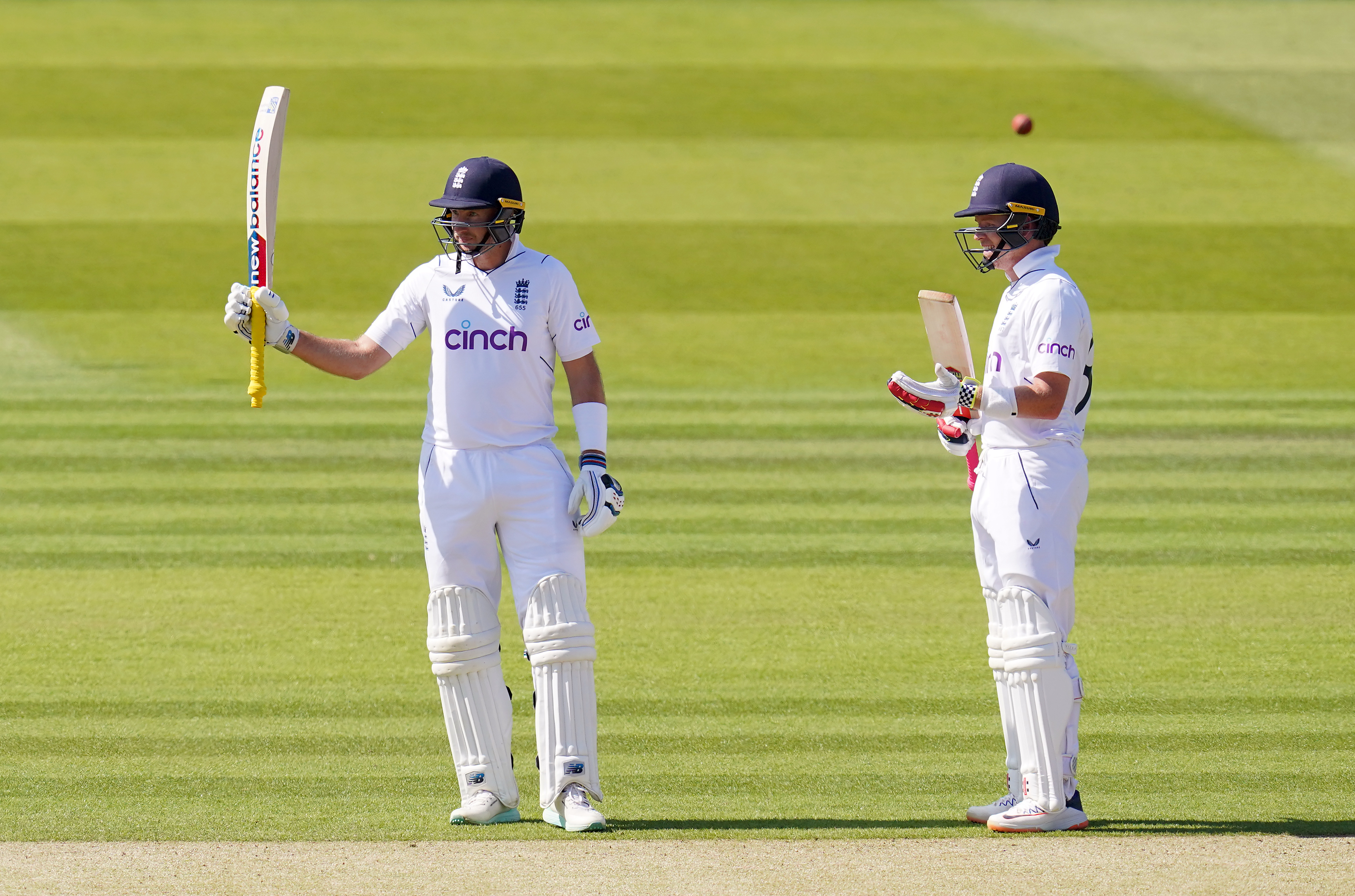 Joe Root, left, celebrates