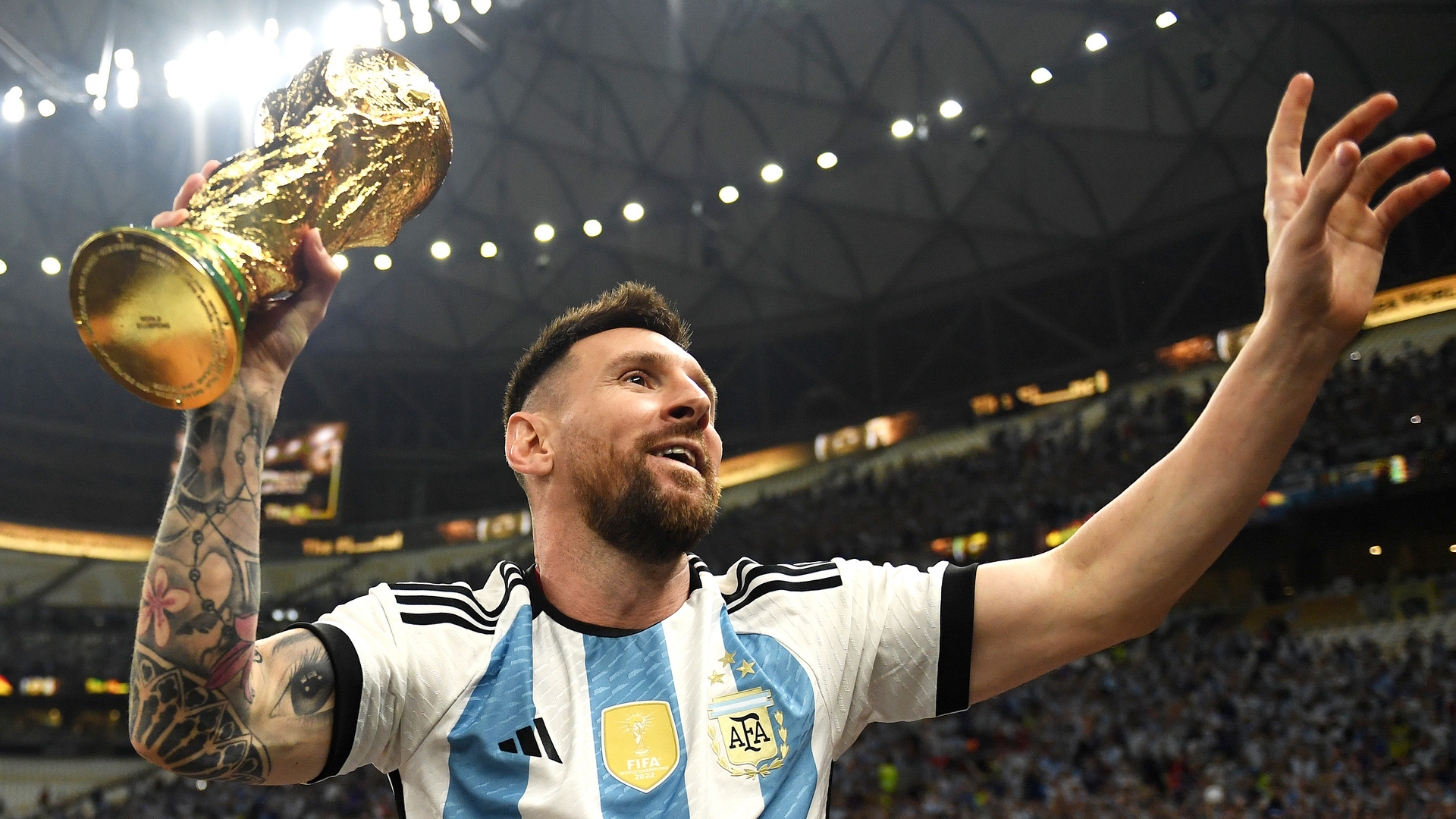 Lionel Messi holds the World Cup trophy after Argentina's triumph