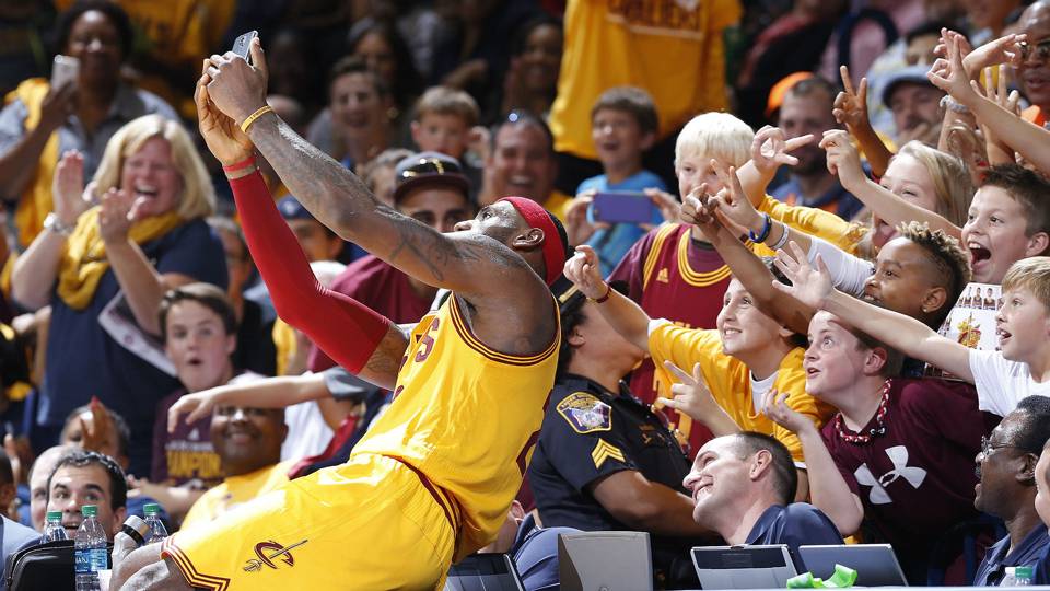 LeBron James with fans via sportingnews.com