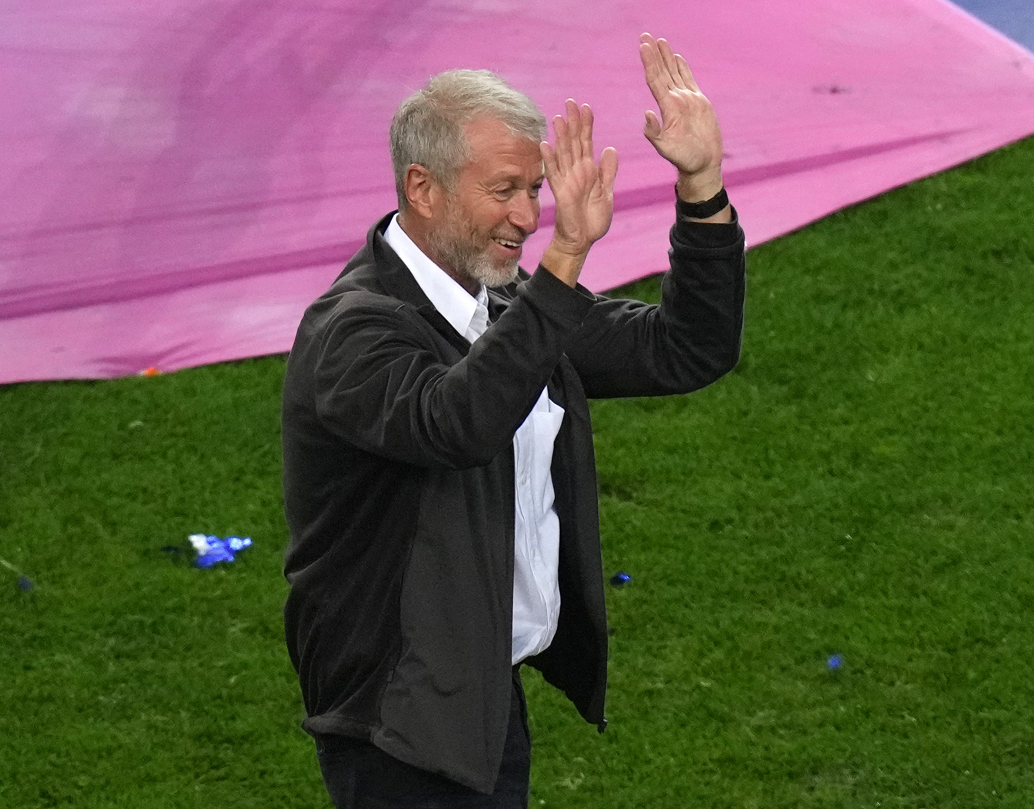 Chelsea owner Roman Abramovich celebrates on the pitch after the London club beat Manchester City in the 2021 Champions League final
