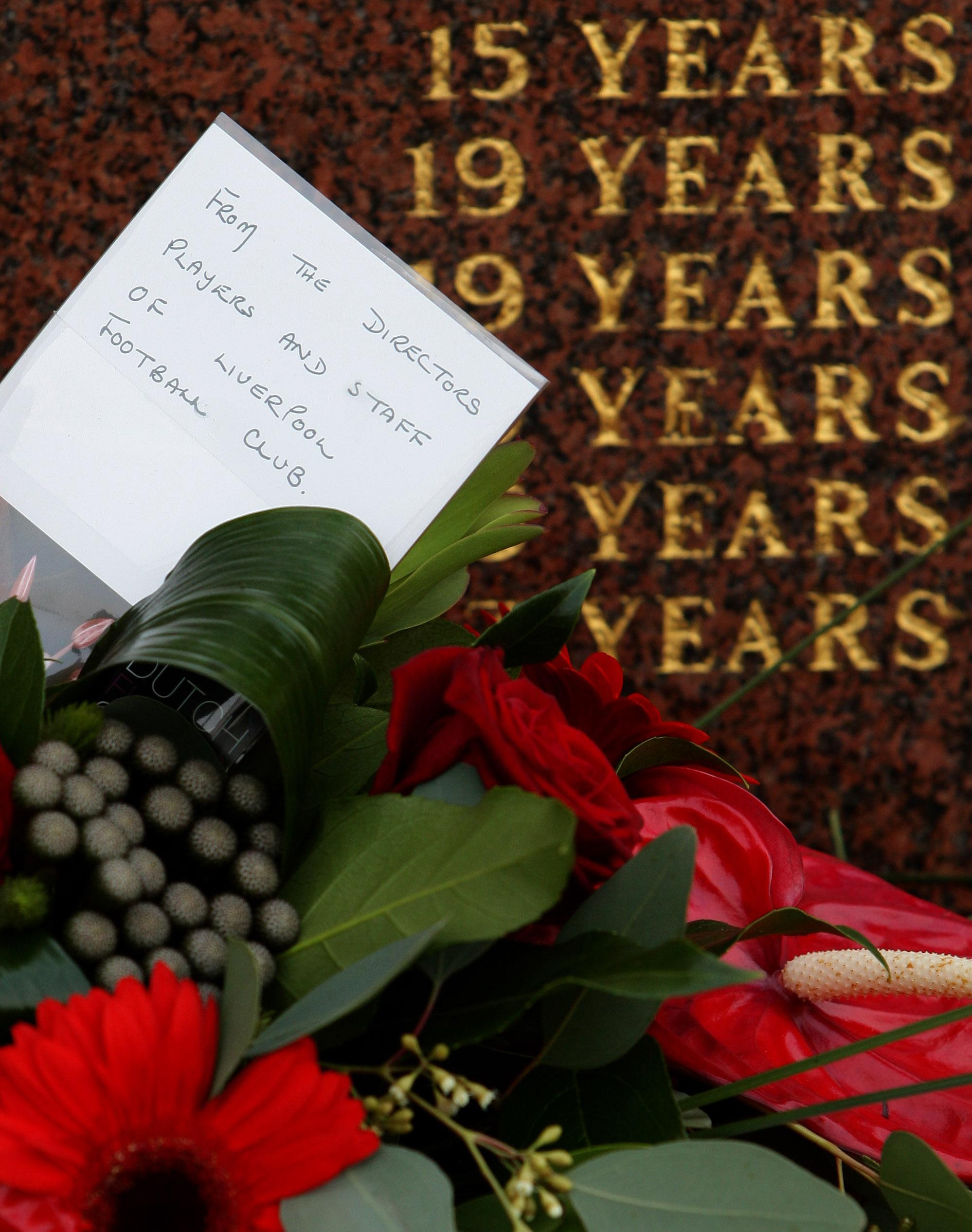 A floral tribute from Liverpool FC sits in front of the Hillsborough Memorial before a memorial service at Liverpool’s Anfield stadium