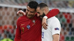 Cristiano Ronaldo and Karim Benzema embrace having scored braces in Budapest.