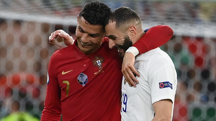 Cristiano Ronaldo and Karim Benzema embrace having scored braces in Budapest.