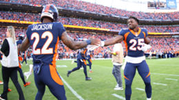 Kareem Jackson and Melvin Gordon III of the Denver Broncos warm up prior to a game against the San Francisco 49ers