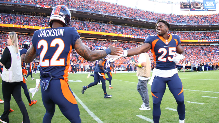 Kareem Jackson and Melvin Gordon III of the Denver Broncos warm up prior to a game against the San Francisco 49ers