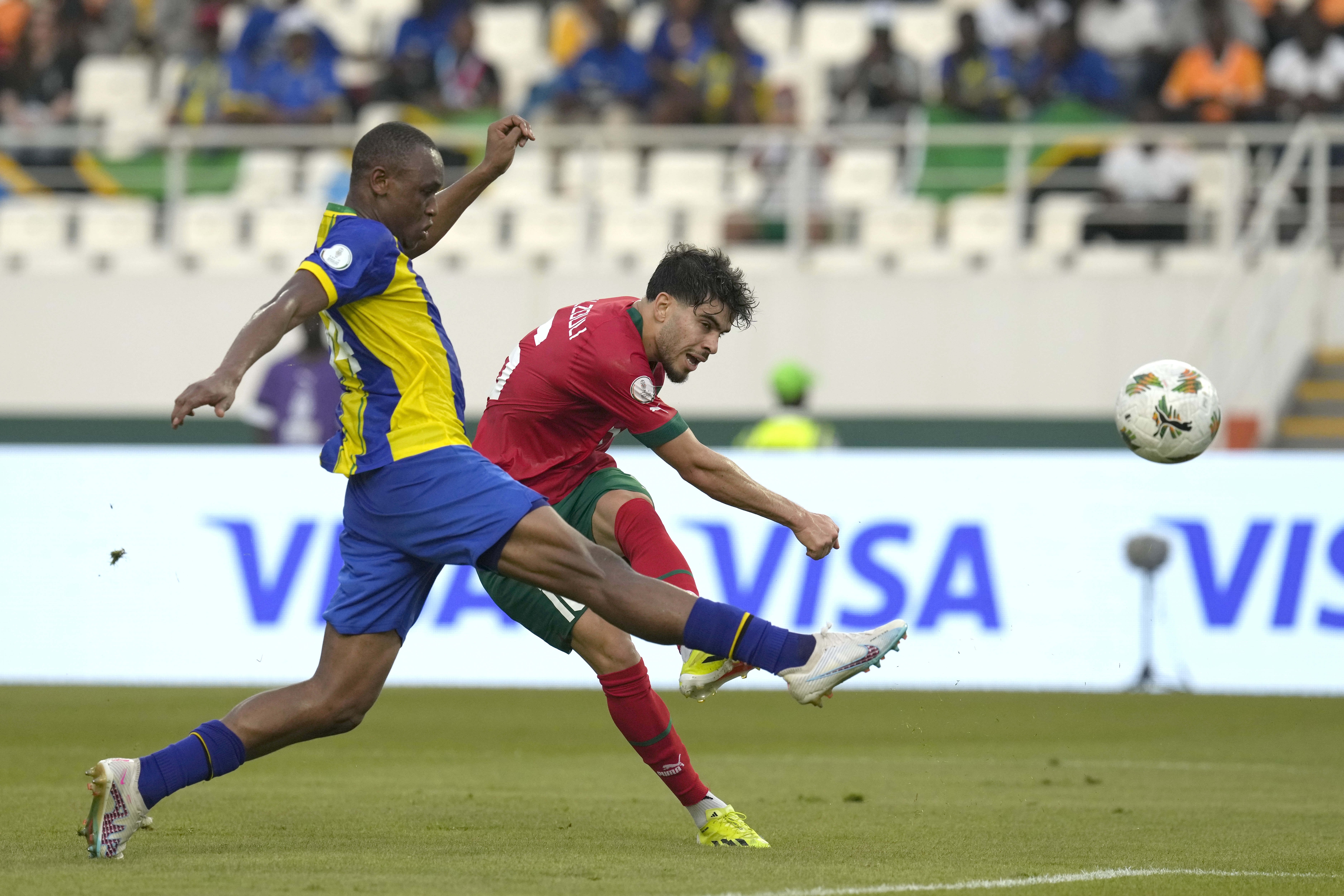 Tanzania’s Bakari Nondo, left, challenges for the ball with Morocco’s Abdessamad Ezzalzouli during the African Cup of Nations Group F soccer match between Morocco and Tanzania at the Laurent Pokou stadium in San Pedro, Ivory Coast, Wednesday, Jan. 17, 2024. (AP Photo/Themba Hadebe)