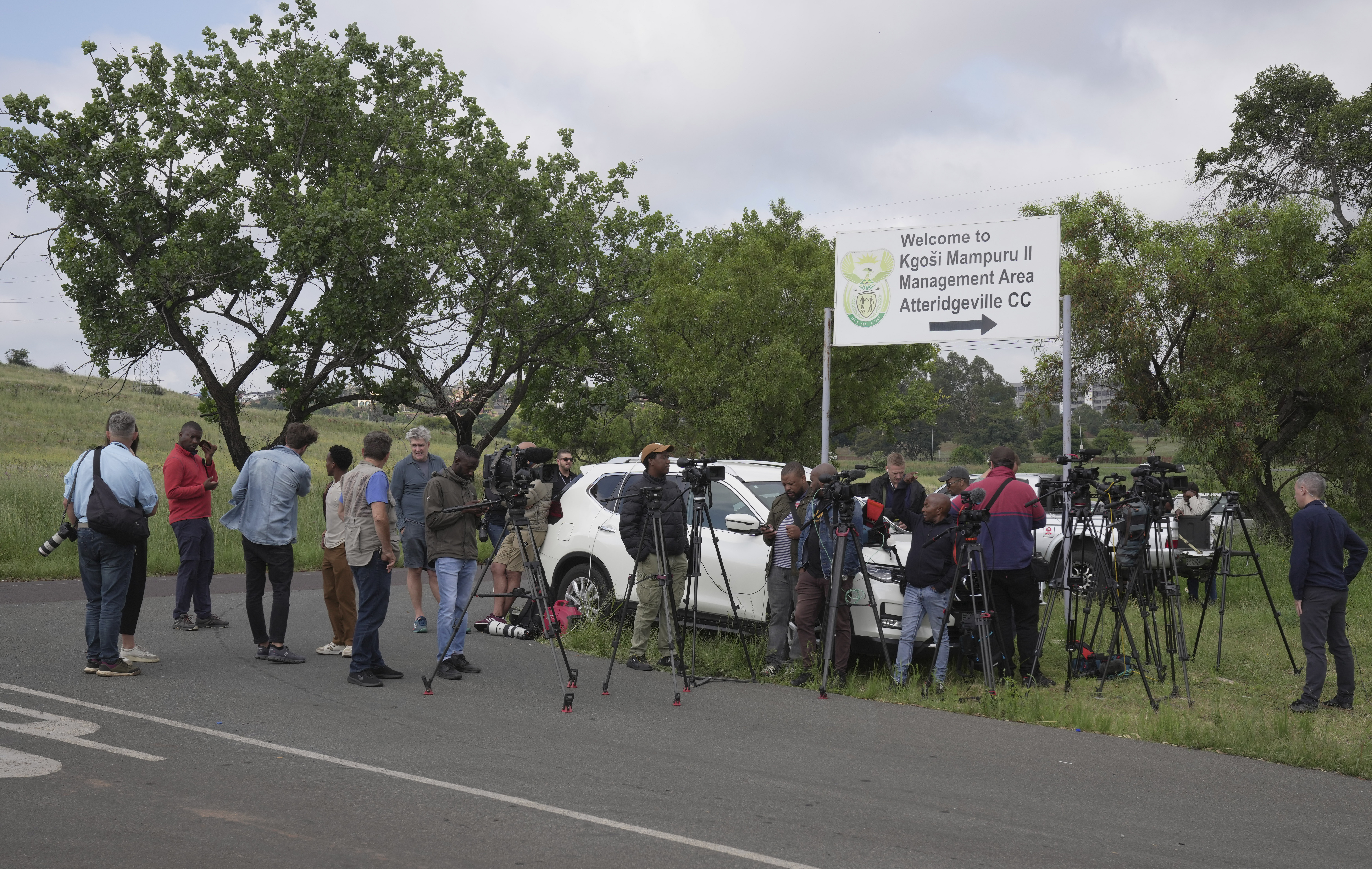 TV crews, photographers and reporters gather outside the gates of the Atteridgeville correctional centre