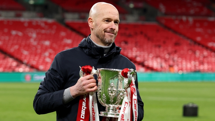Erik ten Hag holds the EFL Cup trophy after Manchester United won at Wembley