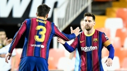 Gerard Pique and Lionel Messi celebrate during Barcelona's win at Valencia