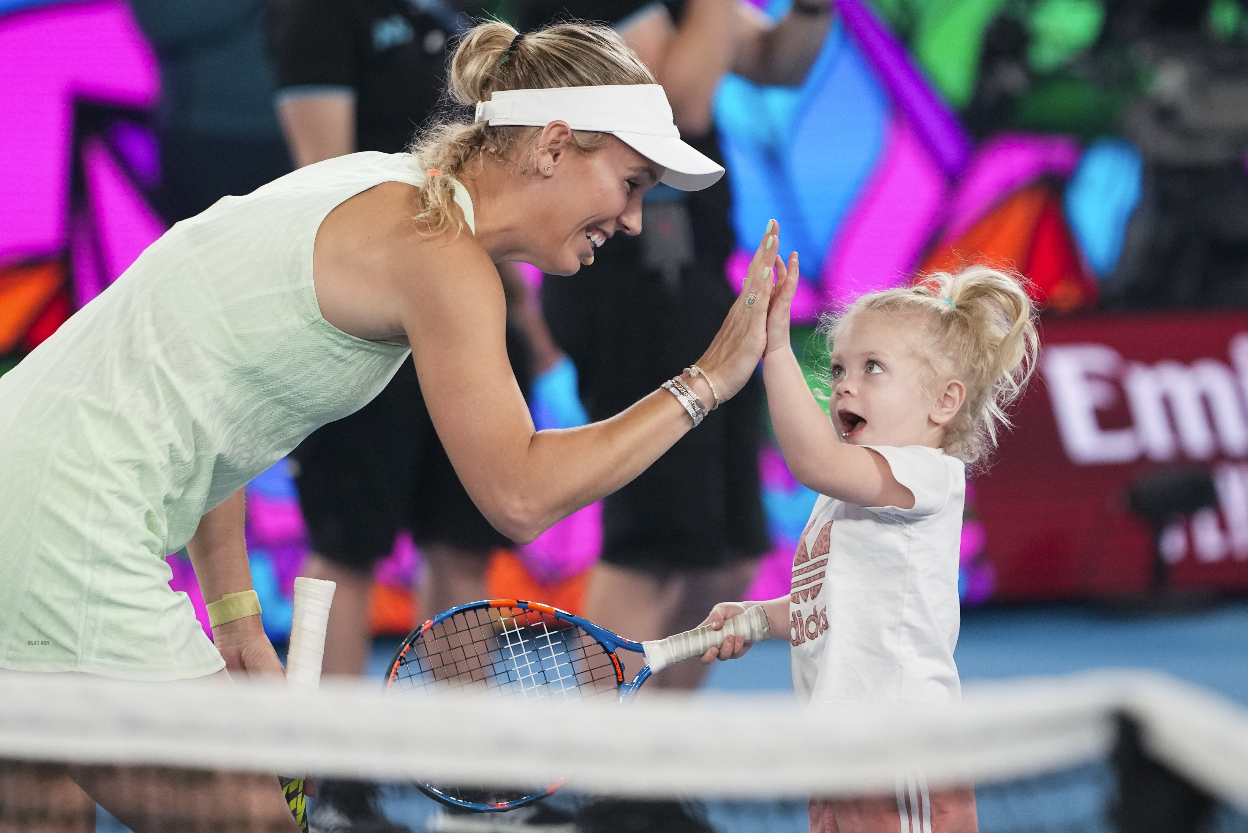 Caroline Wozniacki with daughter Olivia at Melbourne Park