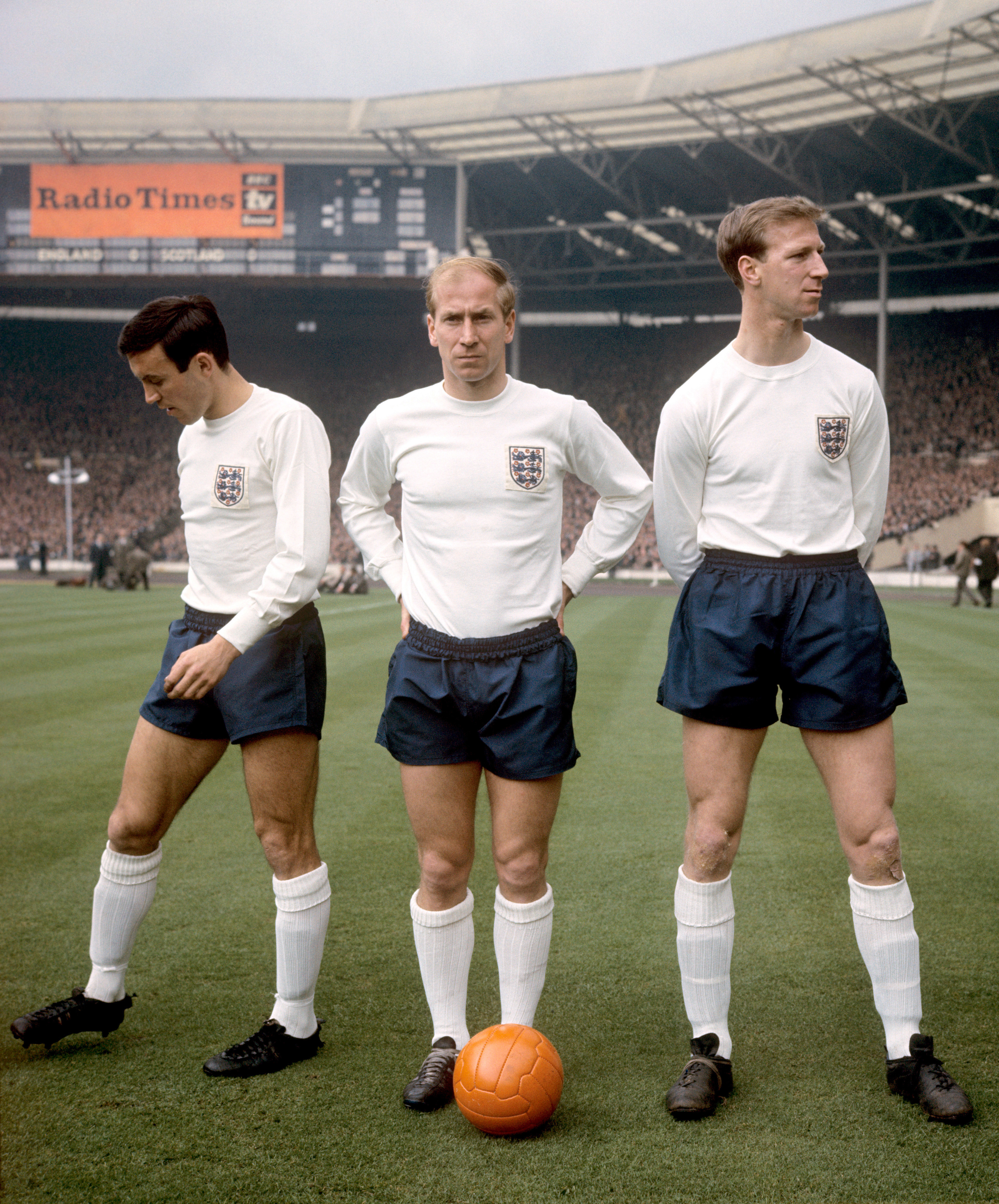 Charlton (centre) with his brother Jack (right). The pair played together for England for the first time in a 2-2 draw with Scotland in April 1965