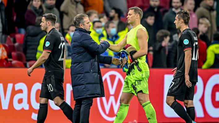 Germany's manager Hansi Flick and captain Manuel Neuer get together after their 1-1 draw against the Netherlands.