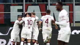 Michel Adopo is mobbed by his Torino team-mates after scoring the winner against Milan
