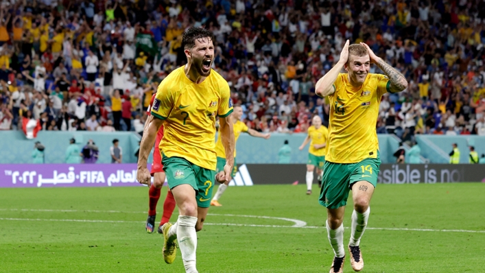 Mathew Leckie (L) celebrates scoring for Australia against Denmark at the 2022 World Cup