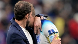 Gareth Southgate comforts Harry Kane at Al Bayt Stadium in Qatar