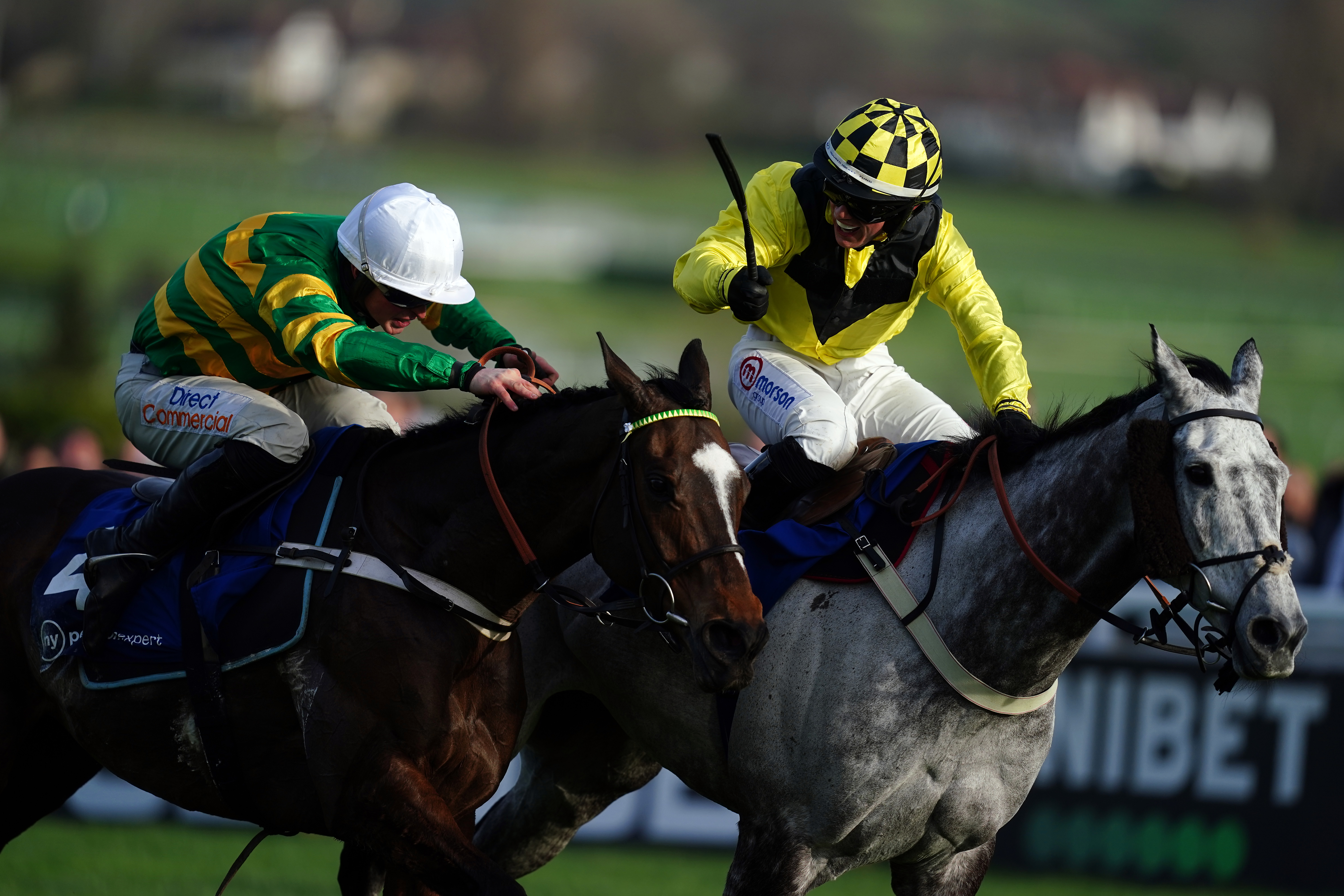 Elixir De Nutz (right) sees off Jonbon in the Clarence House Chase at Cheltenham