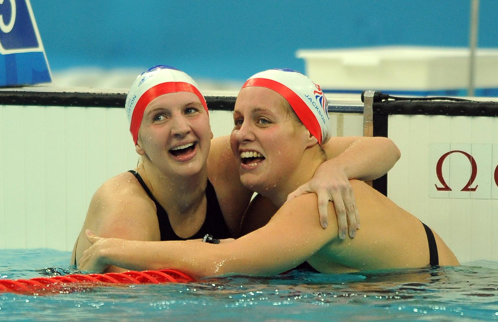 Great Britain’s Rebecca Adlington (left) celebrates her gold medal with Joanne Jackson, who took bronze, at the end of the women’s 400m freestyle