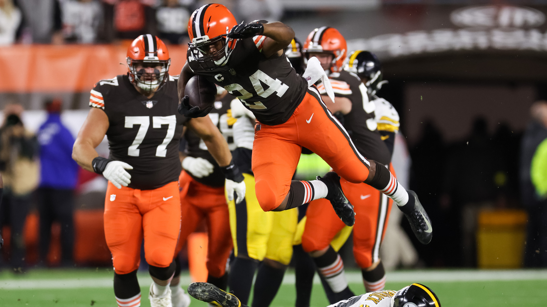 Nick Chubb goes flying through the air as he jumps over Steelers safety Minkah Fitzpatrick
