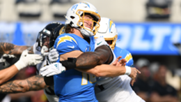 Los Angeles Chargers quarterback Justin Herbert is hit after throwing a pass during the NFL regular season game against the Jacksonville Jaguars