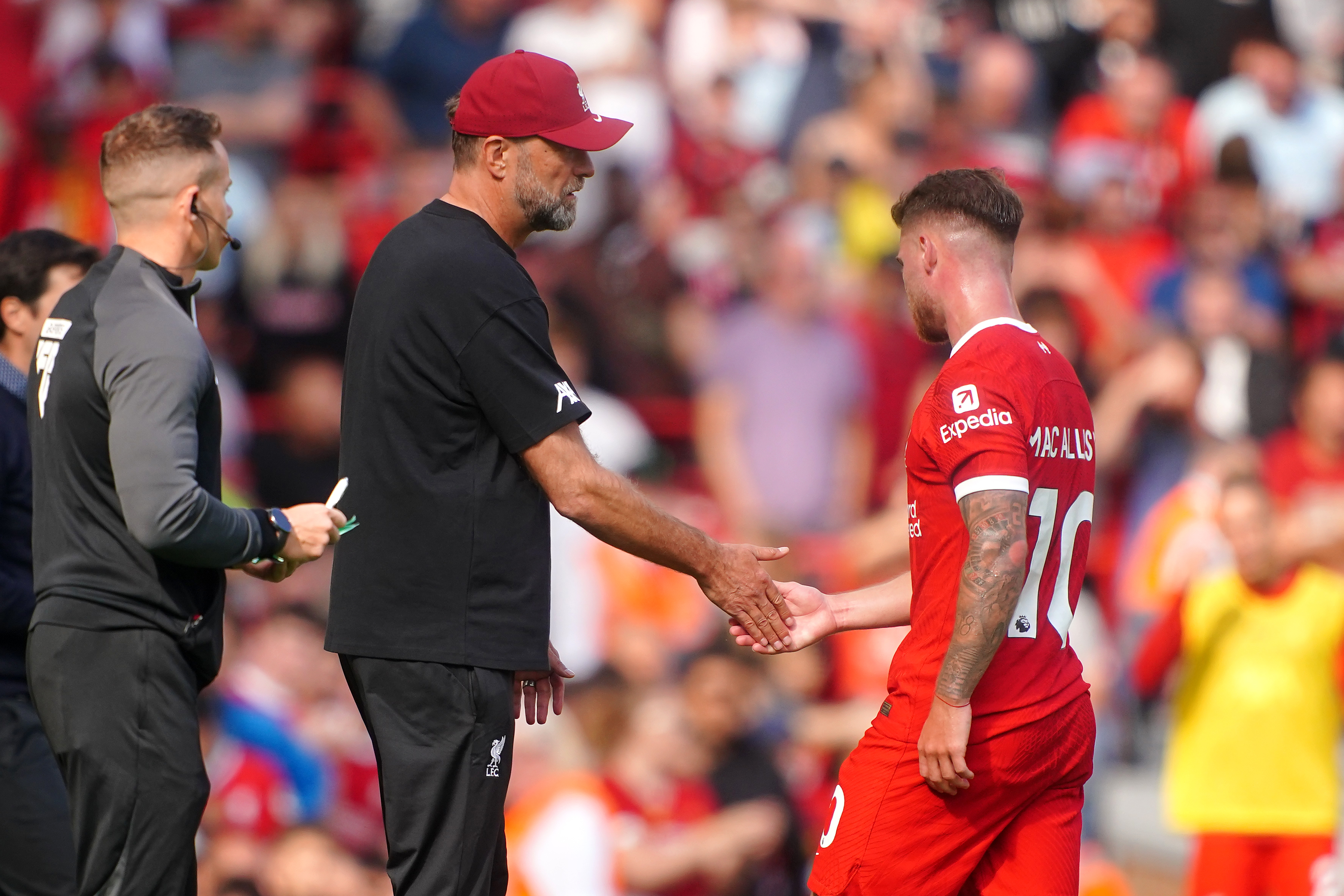 Liverpool’s Alexis Mac Allister (right) is acknowledged by manager Jurgen Klopp after being shown a red card