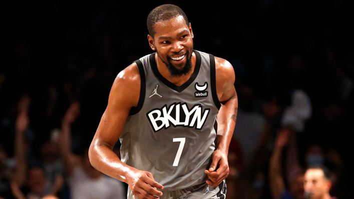 Kevin Durant #7 of the Brooklyn Nets smiles after making a basket during the first half against the Washington Wizards at Barclays Center