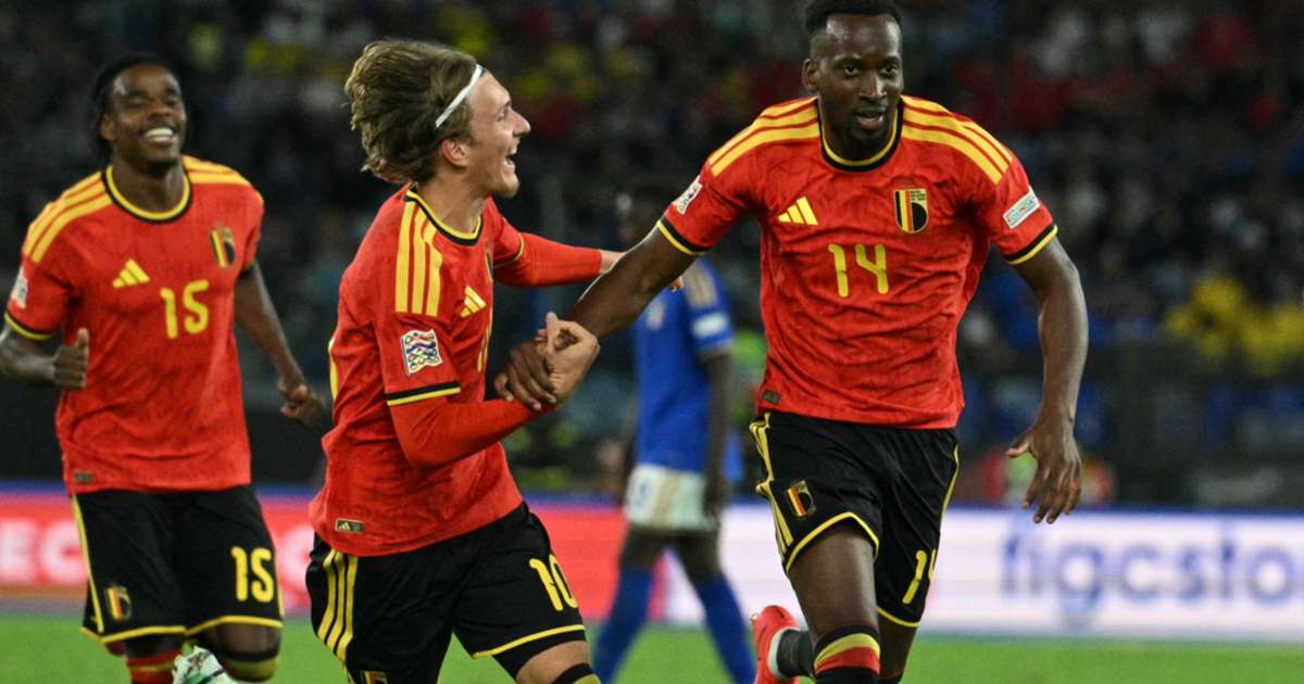 Mika Godts and Dodi Lukebakio celebrate Belgium's goals against Italy