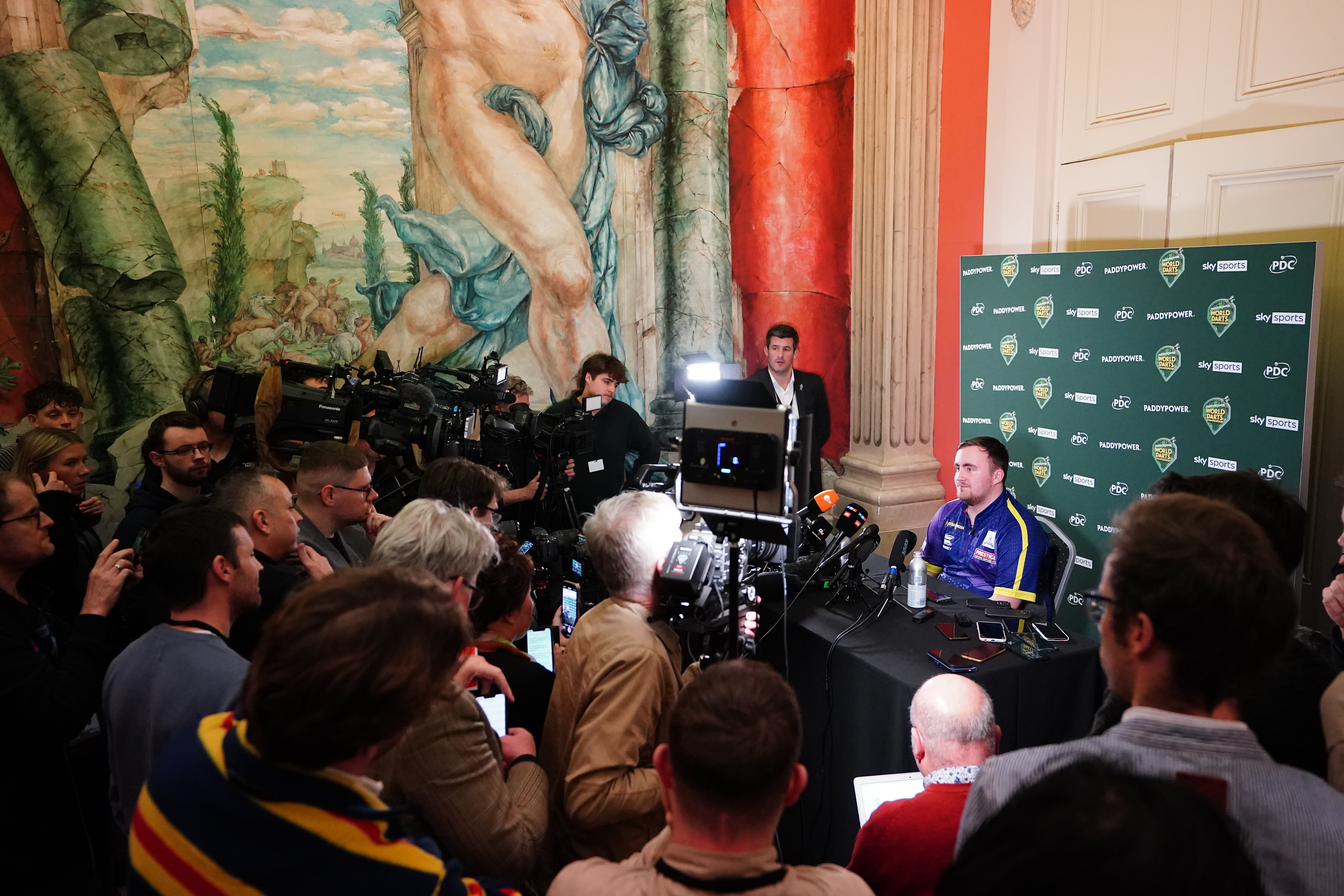 Luke Littler speaks to the media after defeating Rob Cross