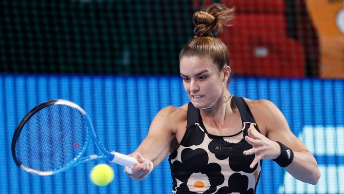 Maria Sakkari hits a forehand against Simona Halep