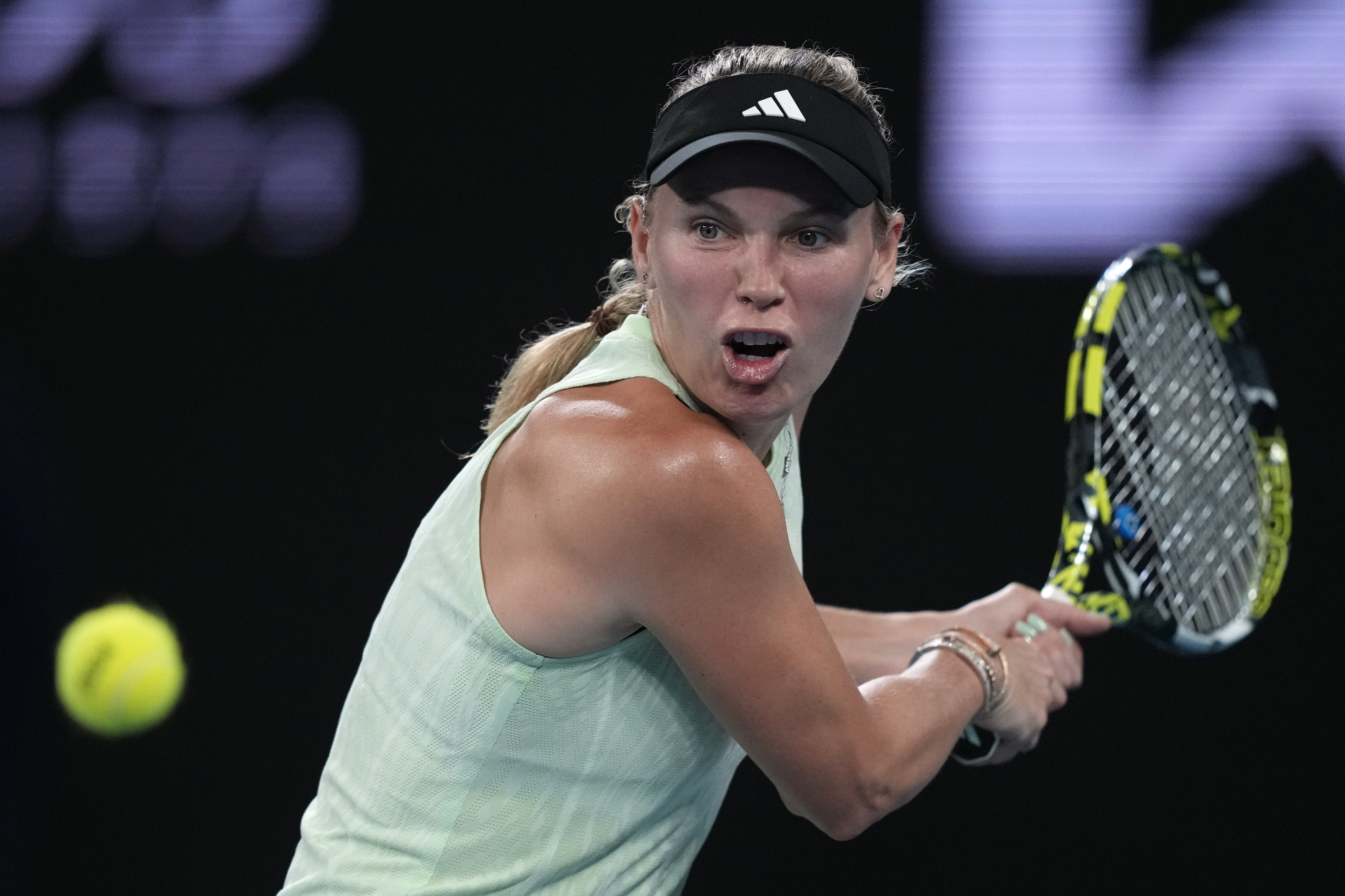 Caroline Wozniacki prepares to hit a backhand